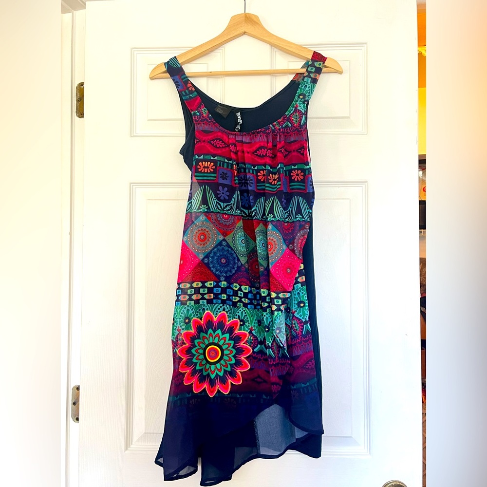 Navy blue with bright flower print. Made in Spain.  Size L.  Never worn.